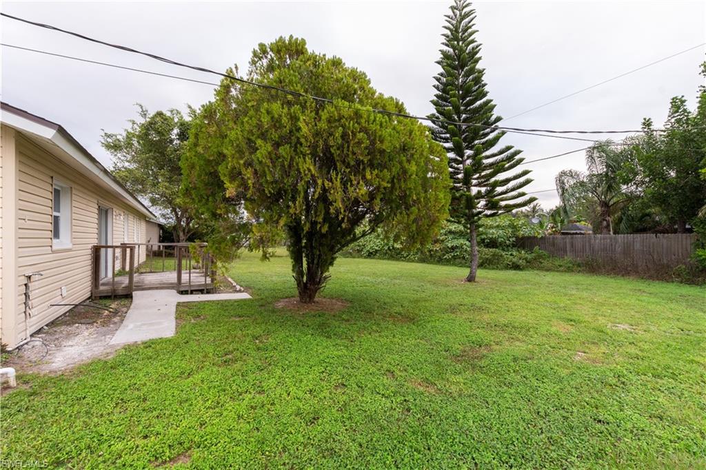 1770 52nd Terrace Southwest Naples, FL 34116 - Photo 5 of 23 a view of a backyard with a small cabin