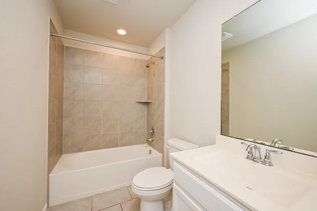 a bathroom with a sink a toilet and a bathtub