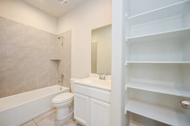 a bathroom with a toilet a sink and a bathtub