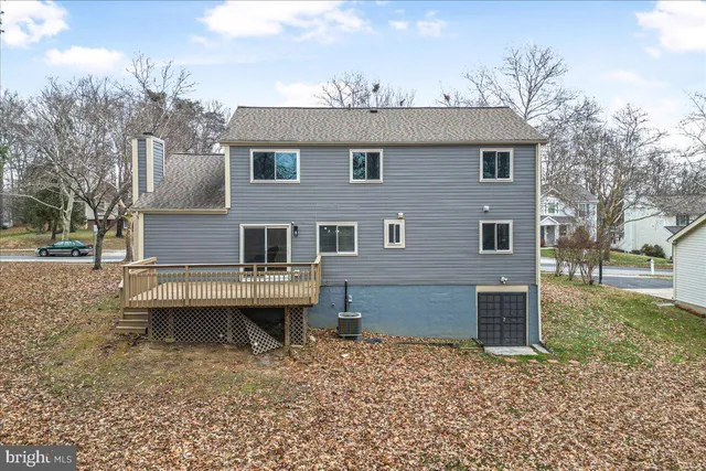 a balcony with wooden floor and fence