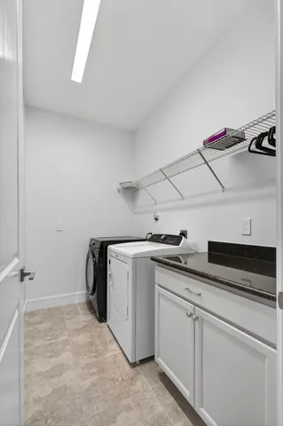 a view of an empty room with windows