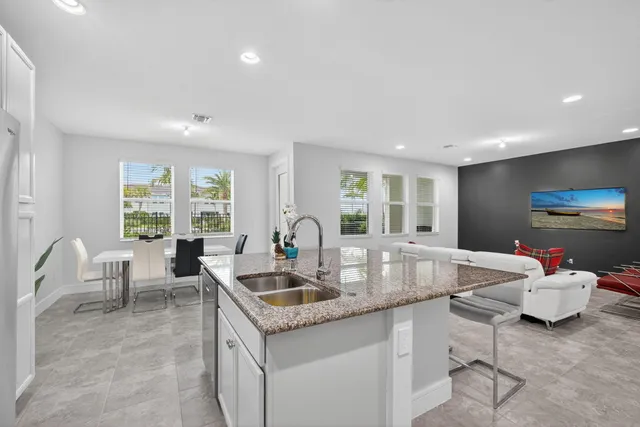 a living room with granite countertop furniture and a large window