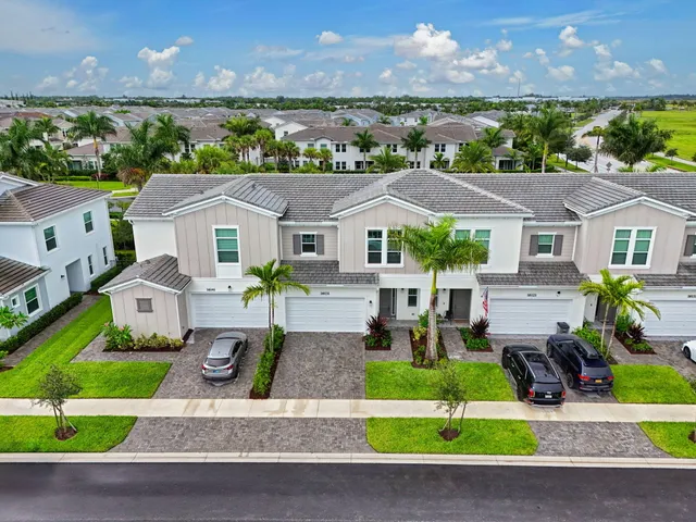 a kitchen with sink a stove and cabinets