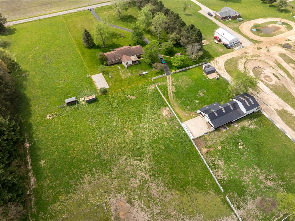 7988 McCool Road Greenville, OH 45331 - Photo 43 of 50 Expansive green acreage with diverse structures offers a canvas for a vibrant rural lifestyle.