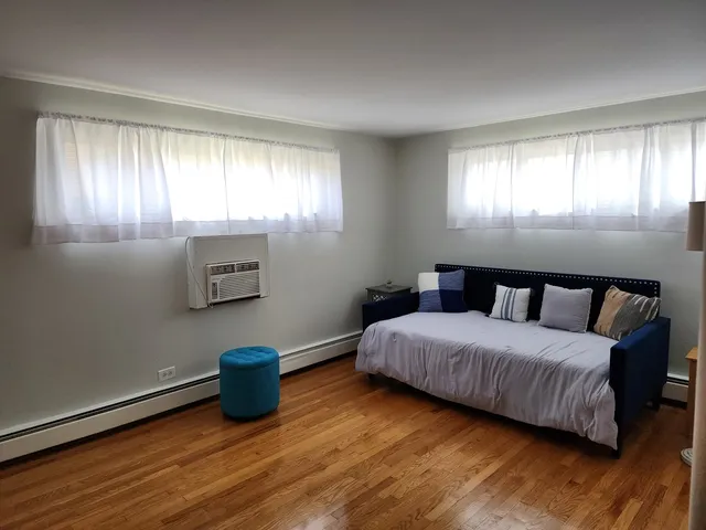 a bedroom with a bed and a tv