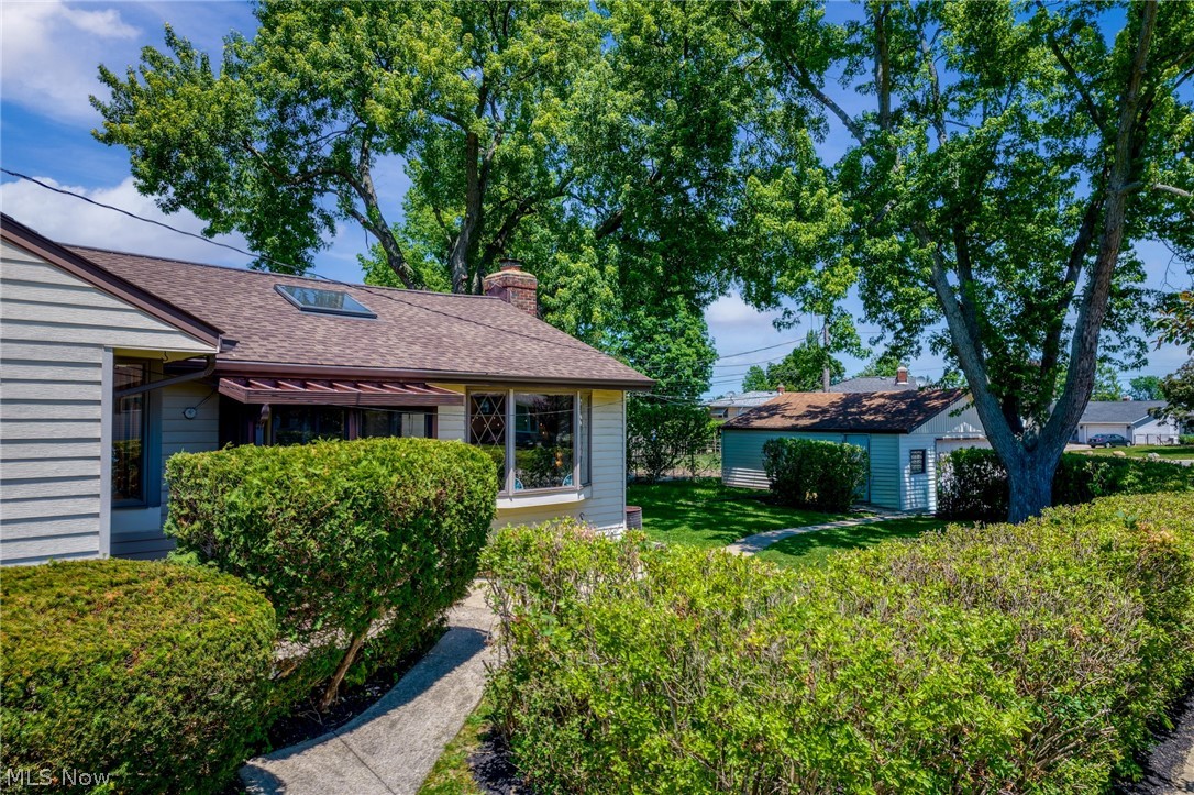 1759 Chelmsford Road Mayfield Heights, OH 44124 - Photo 27 of 39 Well maintained landscaping offers a mix of sun and shade in the side and rear yards.