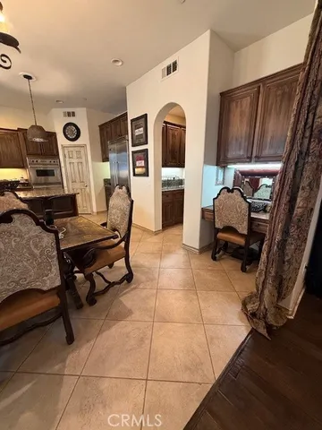 a kitchen with cabinets and stainless steel appliances