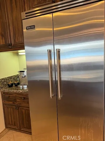 a stove top oven sitting inside of a kitchen