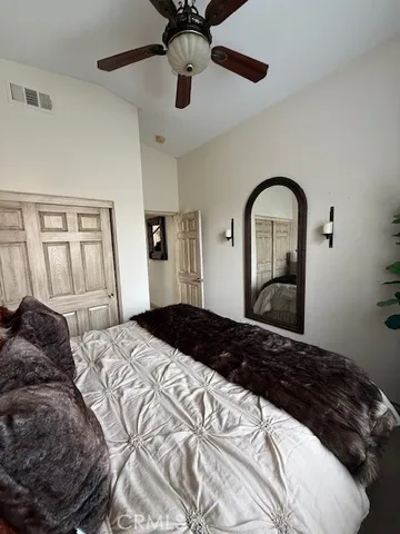 a bathroom with a toilet a sink and a mirror