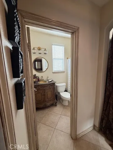 a livingroom with a couch and a window