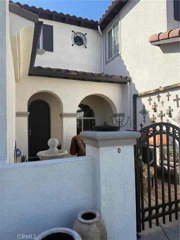 a living room with furniture and wall paintings