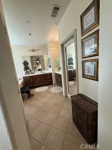 a bathroom with a tub sink and mirror