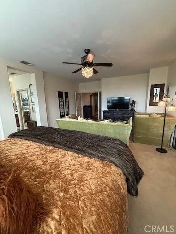 a view of bathroom with a sink and mirror