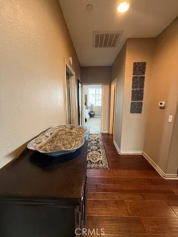 a bedroom with bed couch and window