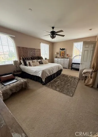 a bed room with a bed and a window