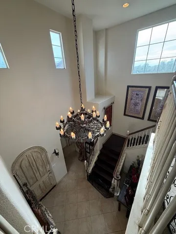 a view of a livingroom with furniture entryway and wooden floor