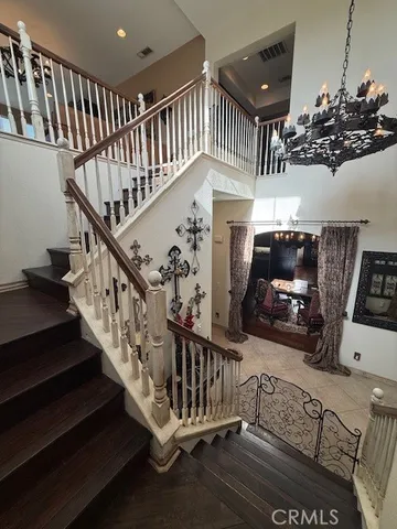 a view of entryway with wooden floor and stairs