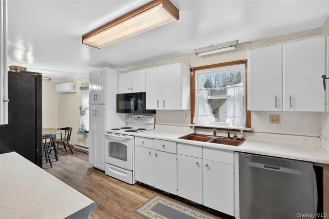 a kitchen with a sink stove and refrigerator