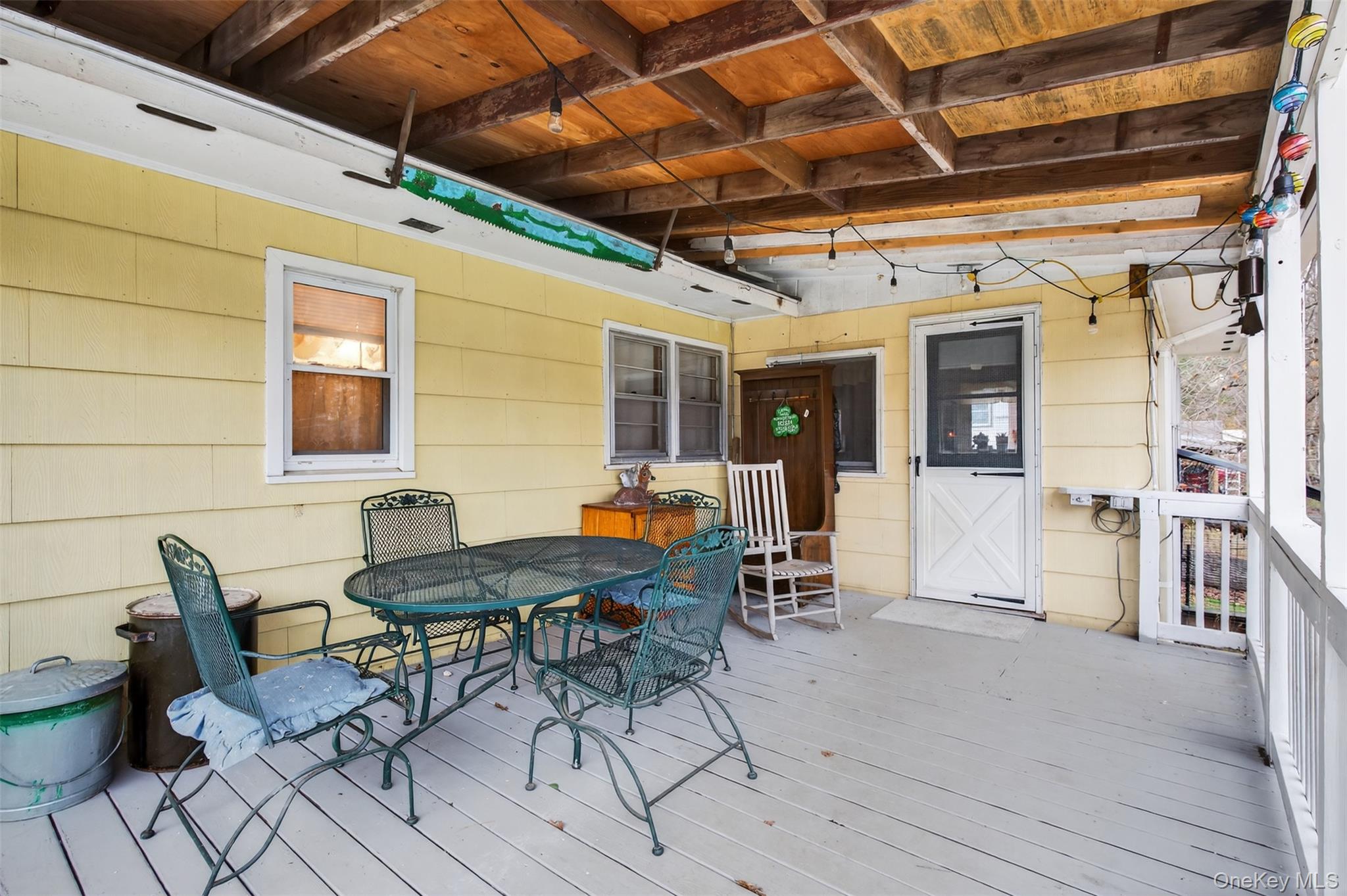 4030 Highway 209, Unit 4028 Stone Ridge, NY 12484 - Photo 20 of 22 a view of a dinning table and chairs in the patio