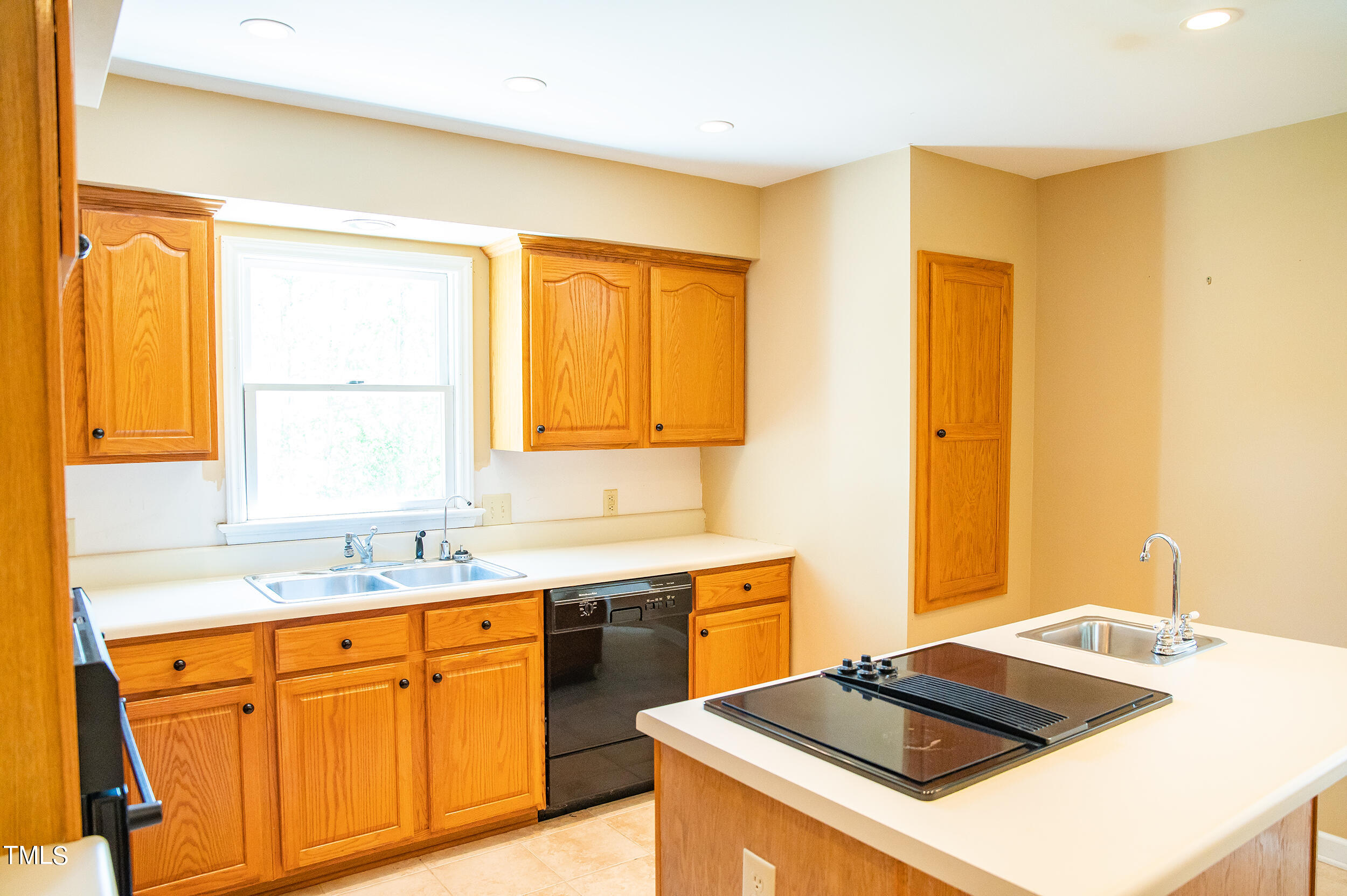 5 Banbury Drive Roxboro, NC 27573 - Photo 13 of 66 a kitchen with a sink a stove and a refrigerator
