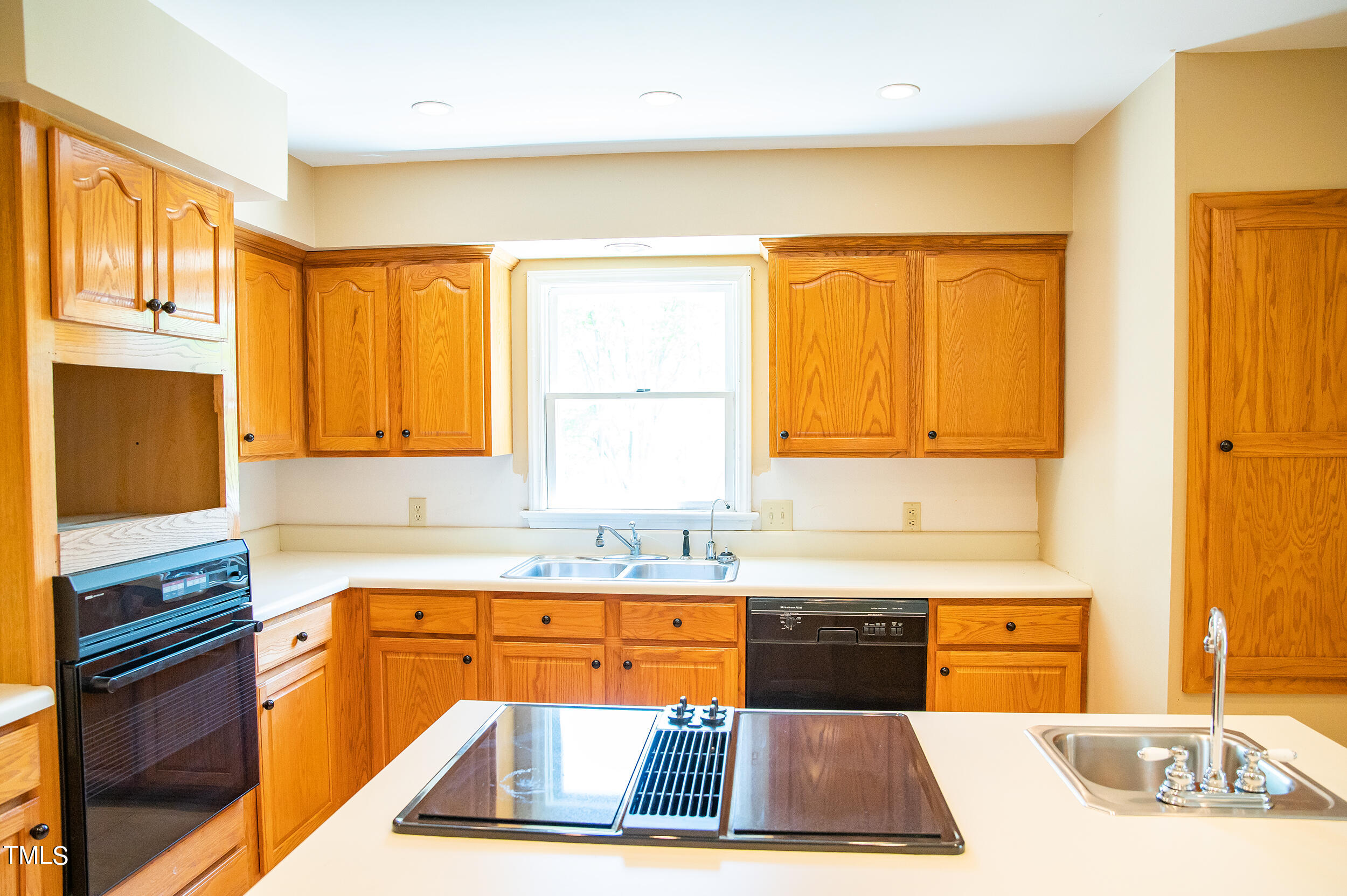 5 Banbury Drive Roxboro, NC 27573 - Photo 14 of 66 a kitchen with a sink a counter top space and cabinets