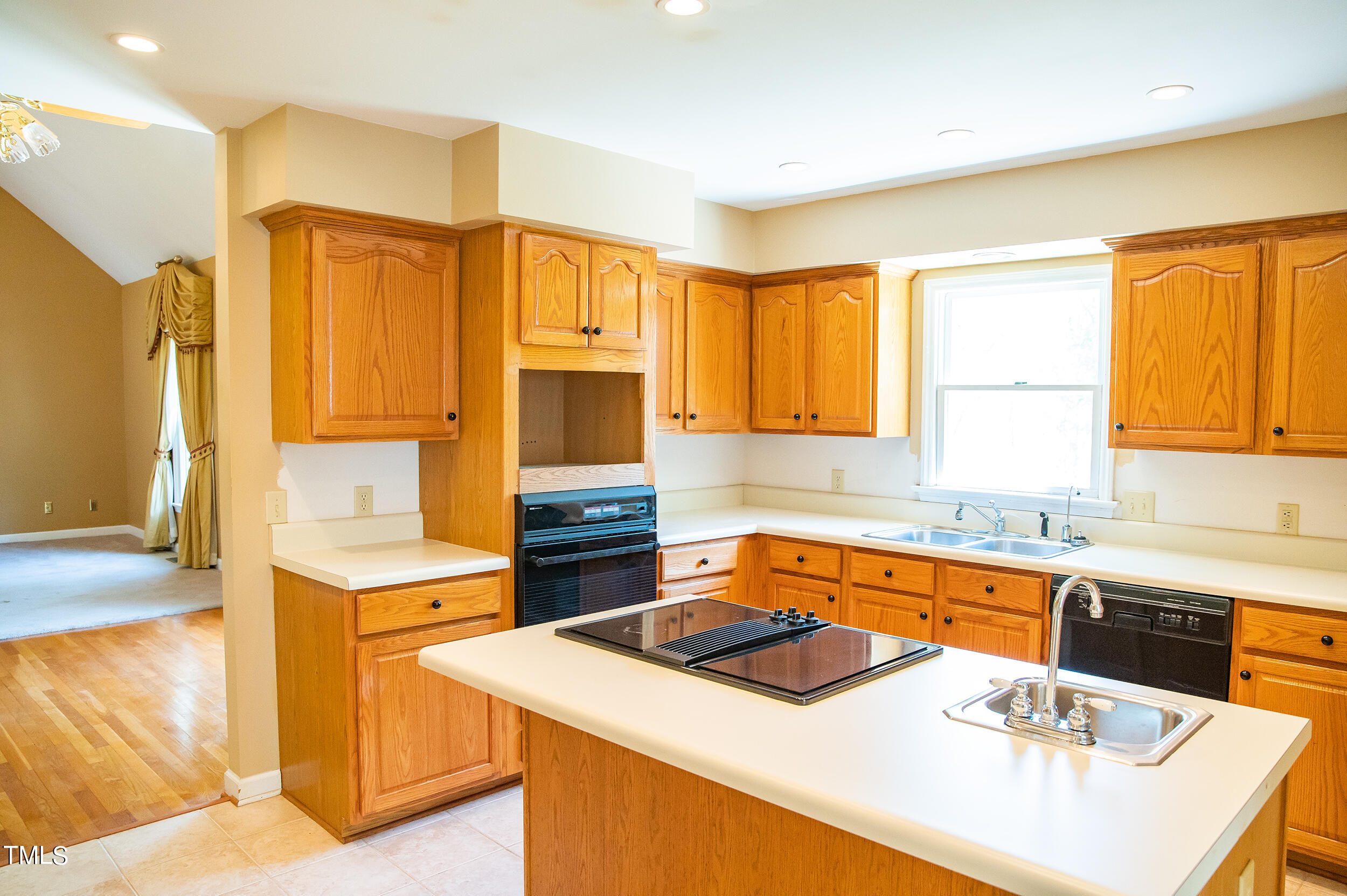 5 Banbury Drive Roxboro, NC 27573 - Photo 15 of 66 a kitchen with a sink a stove and a refrigerator