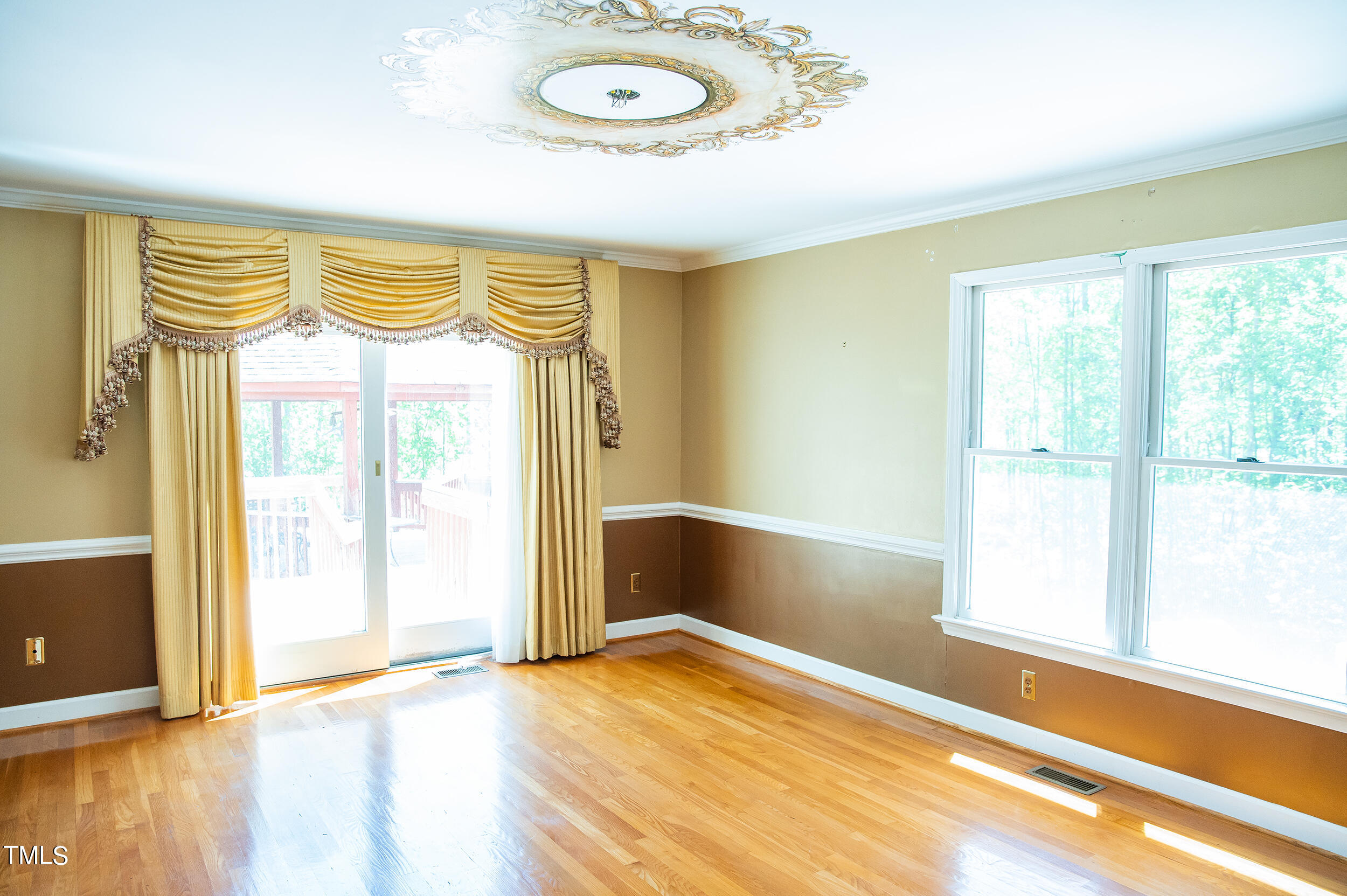 5 Banbury Drive Roxboro, NC 27573 - Photo 22 of 66 an empty room with wooden floor and windows