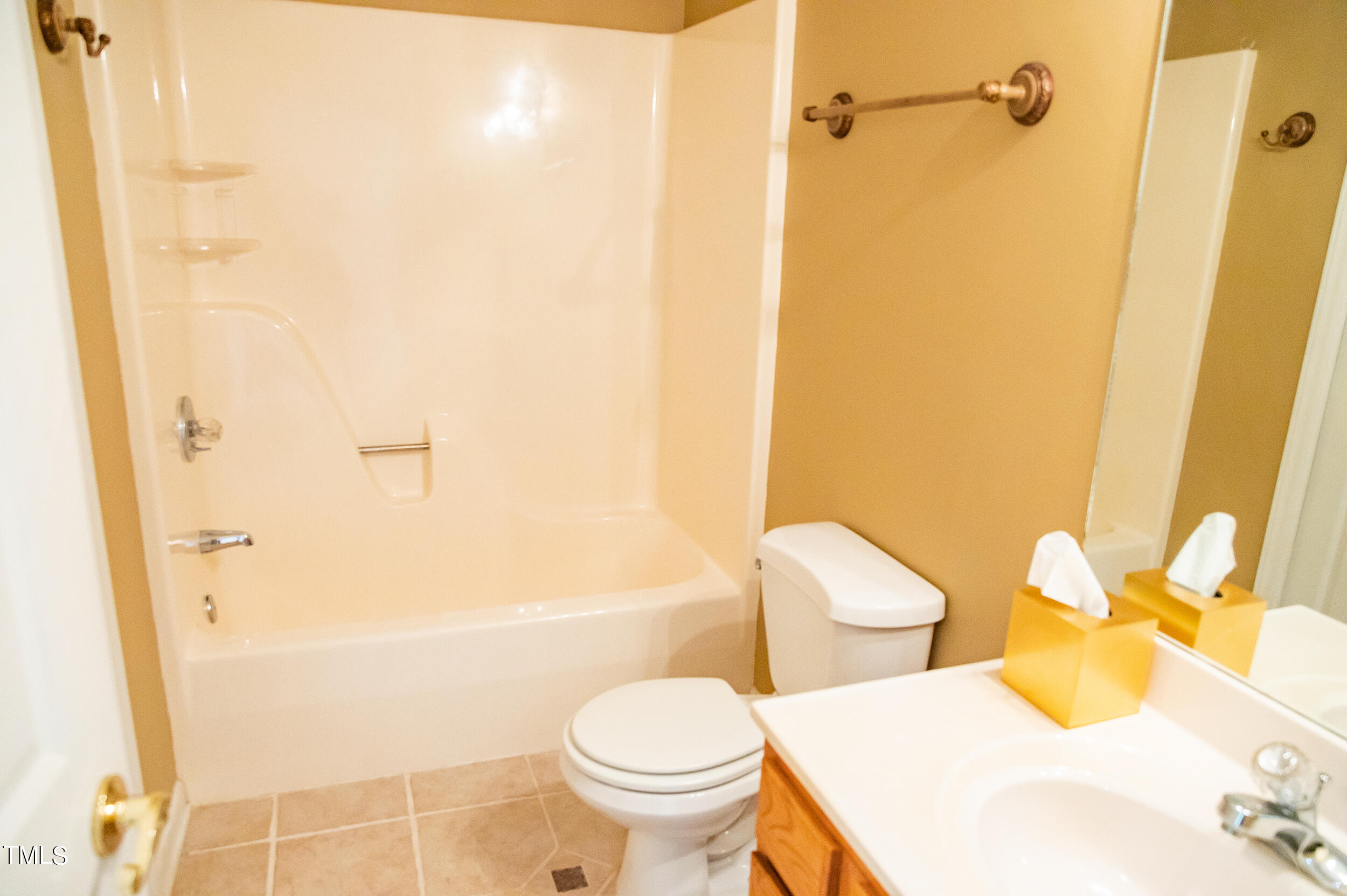 5 Banbury Drive Roxboro, NC 27573 - Photo 24 of 66 a white toilet sitting next to a bathroom sink and a shower