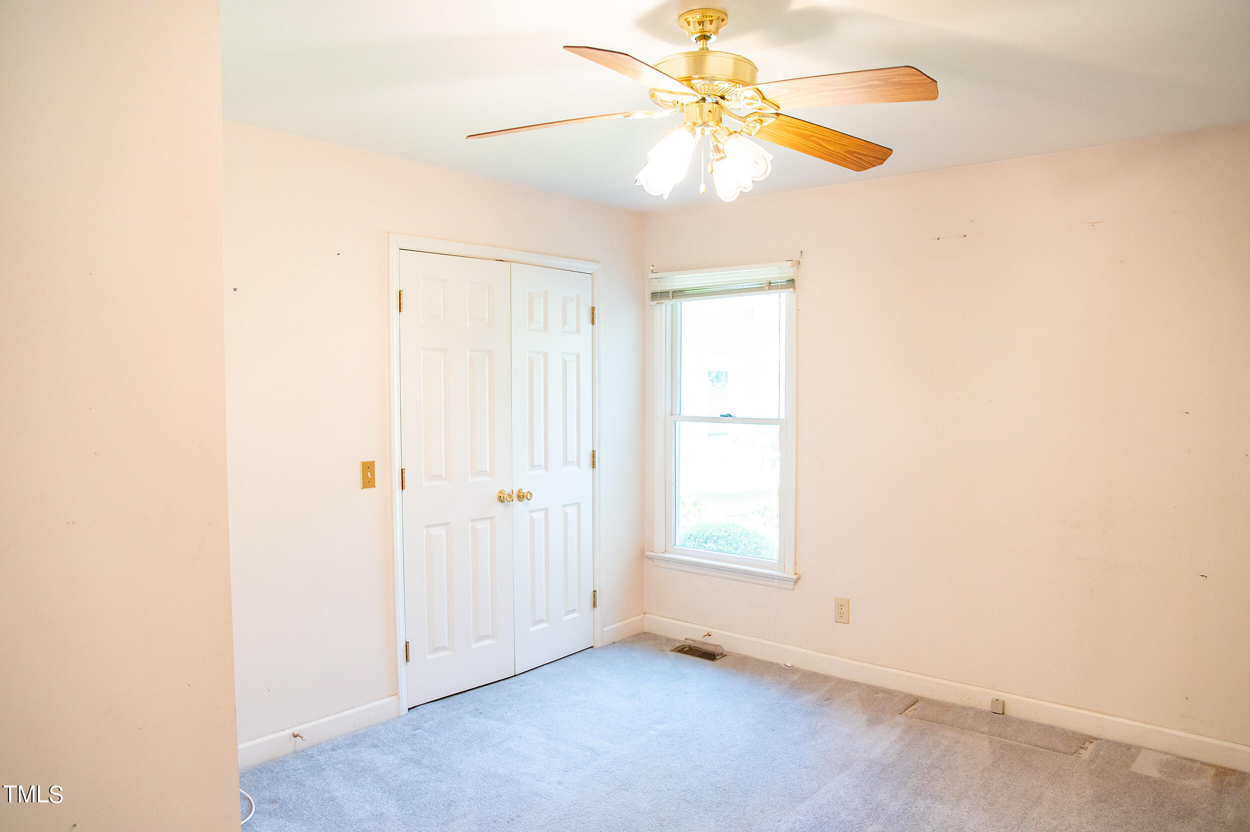 5 Banbury Drive Roxboro, NC 27573 - Photo 27 of 66 an empty room with a window and a fan