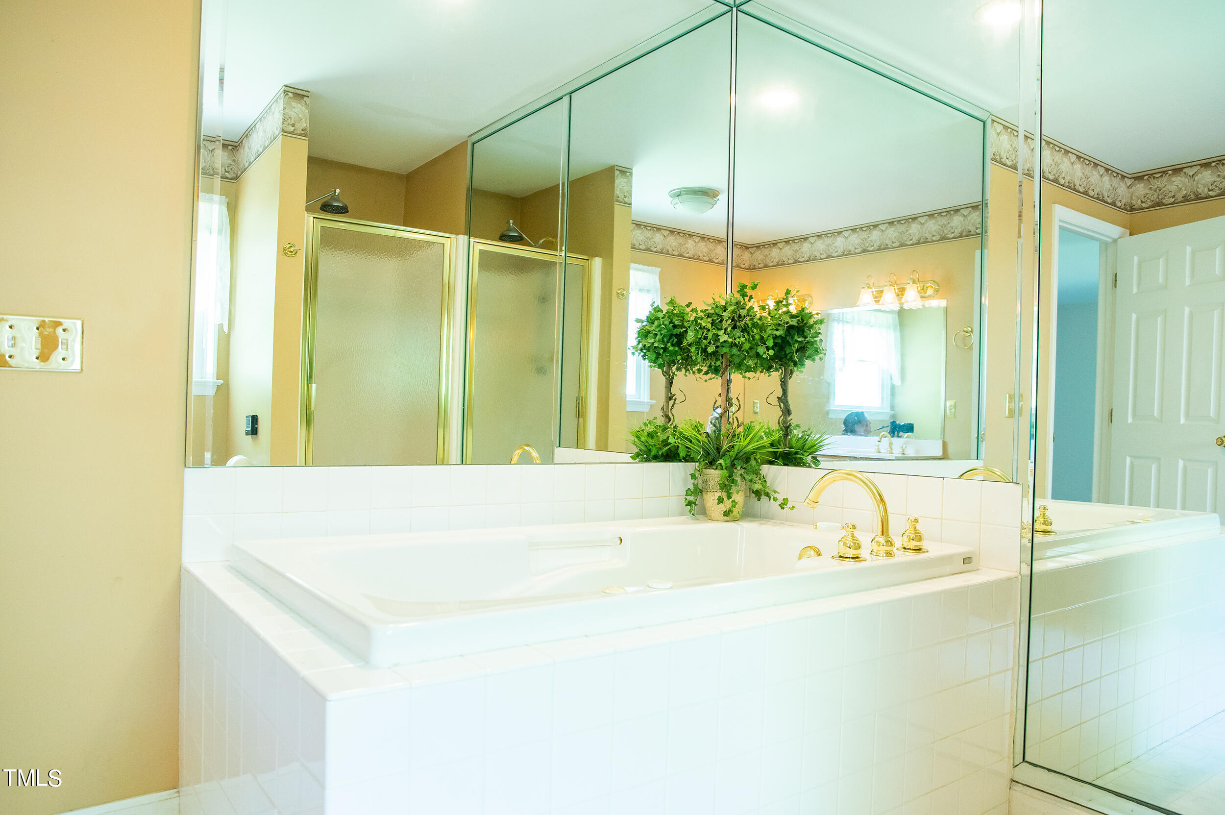 5 Banbury Drive Roxboro, NC 27573 - Photo 34 of 66 a bathroom with a tub sink and glass door shower