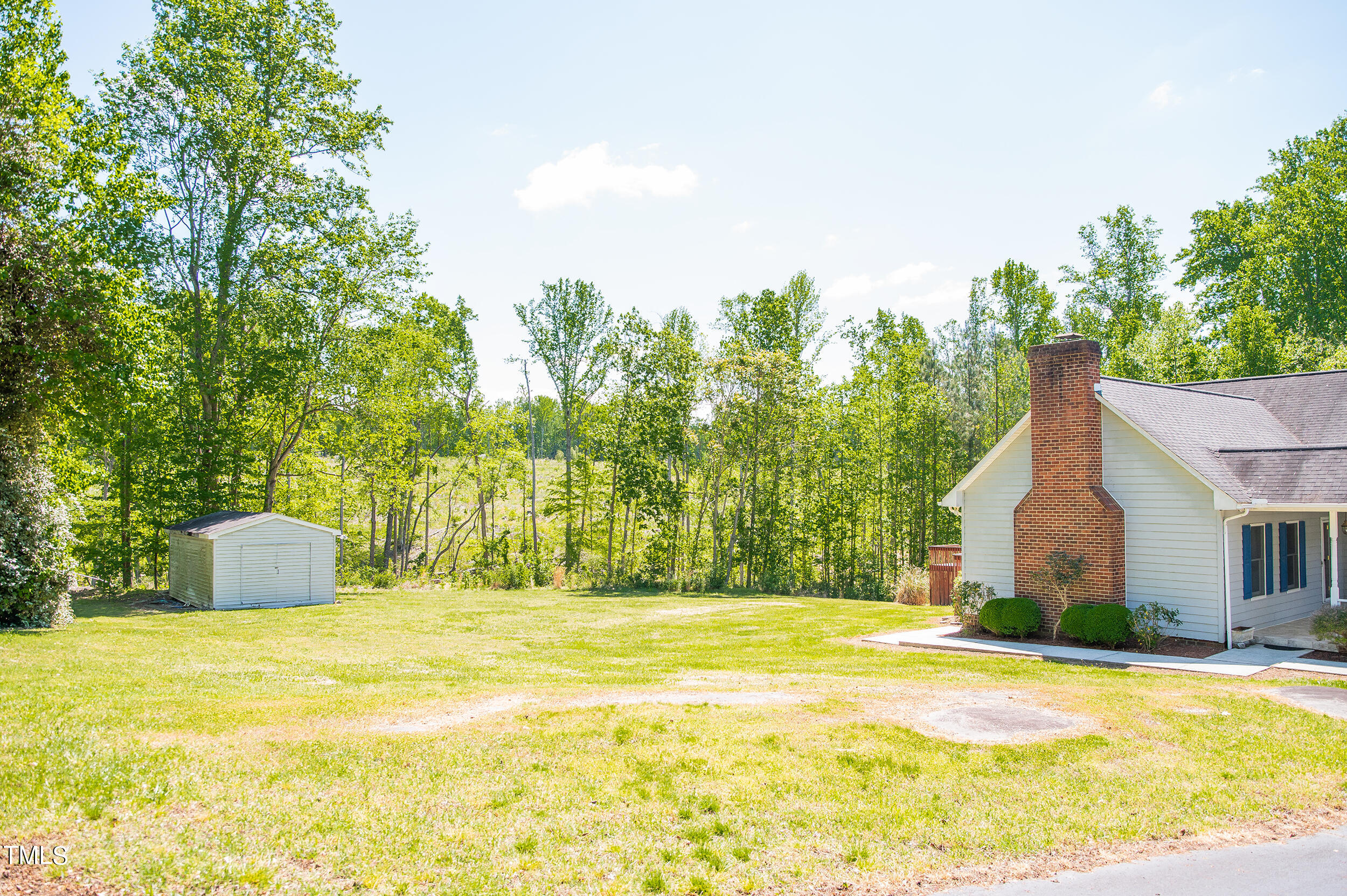 5 Banbury Drive Roxboro, NC 27573 - Photo 66 of 66 a view of swimming pool with large trees and wooden fence