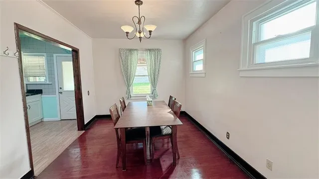 a view of a dining room with furniture and window