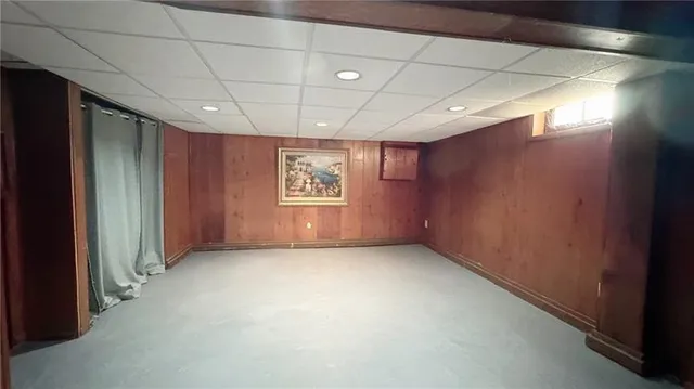 a view of a house with a small yard and plants