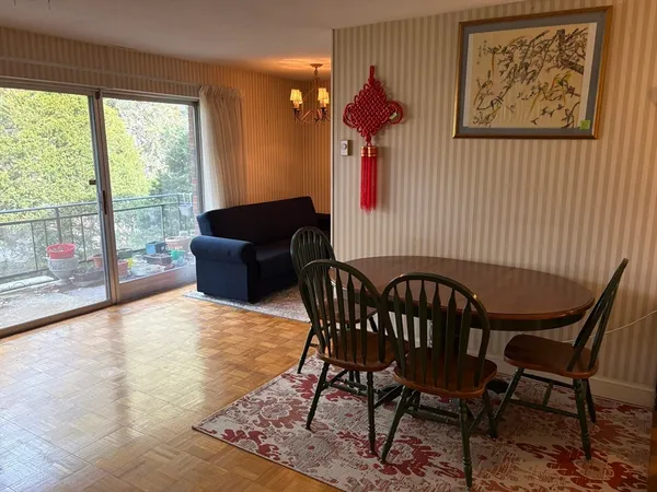 a view of a dining room with furniture window and outside view