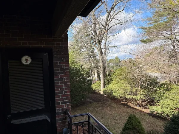 a wooden bench sitting in front of a house