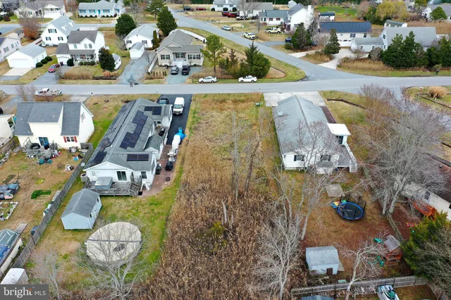 an aerial view of a house with outdoor space swimming pool