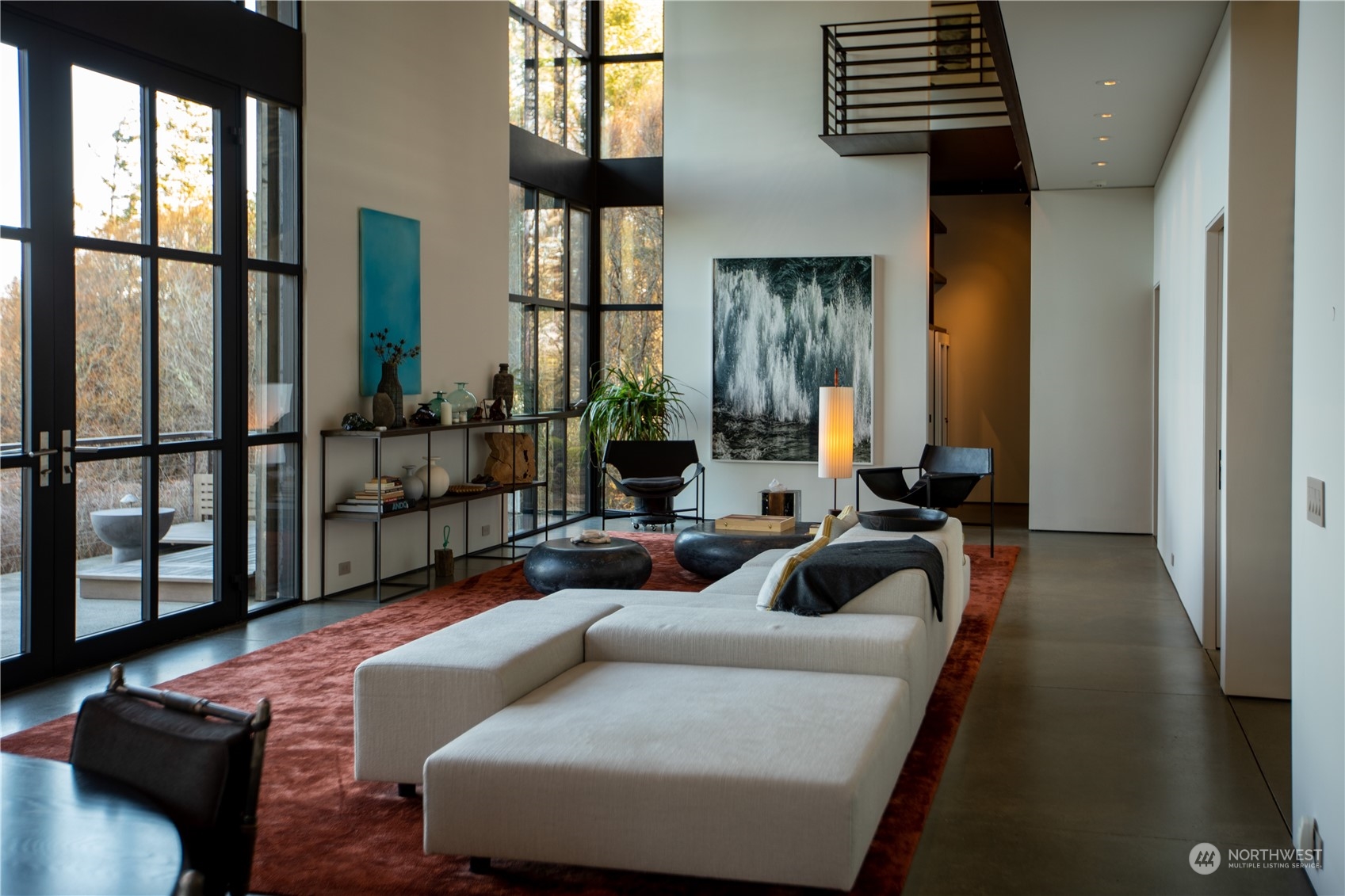 265 Rainshadow Road San Juan Island, WA 98250 - Photo 12 of 40 a living room with furniture and a large window