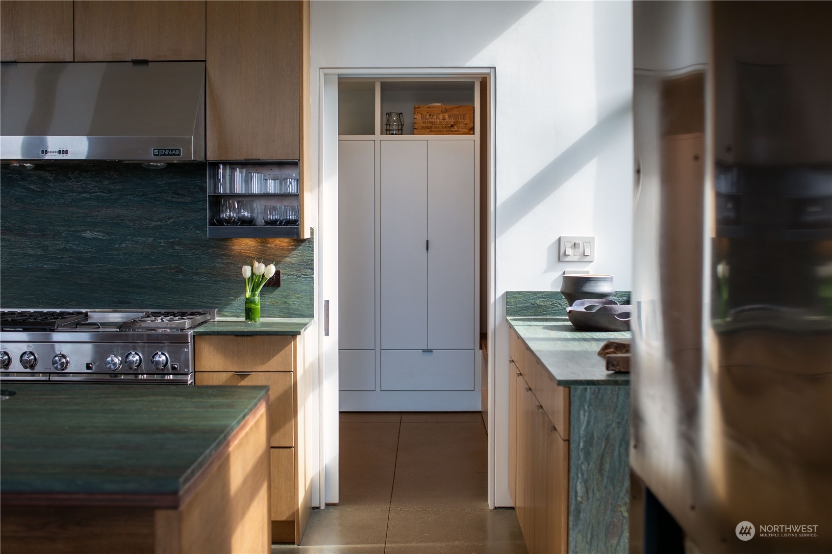 265 Rainshadow Road San Juan Island, WA 98250 - Photo 17 of 40 a kitchen with stainless steel appliances granite countertop a stove and a refrigerator
