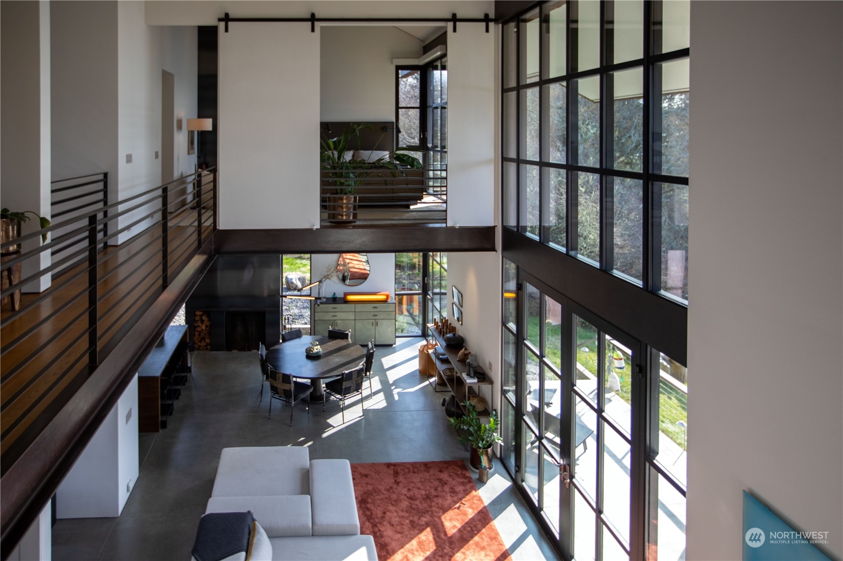265 Rainshadow Road San Juan Island, WA 98250 - Photo 21 of 40 a room with lots of furniture and a window