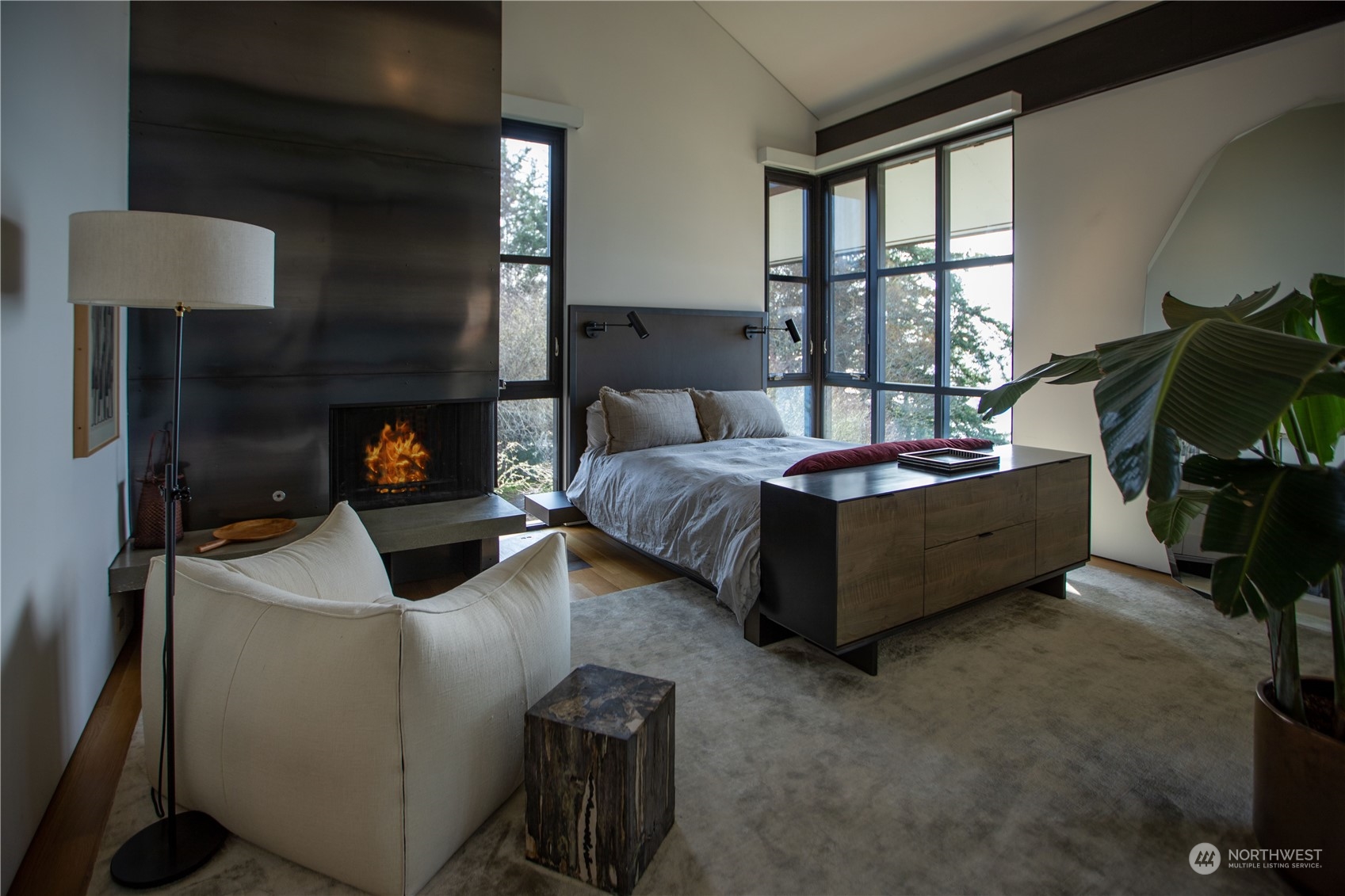 265 Rainshadow Road San Juan Island, WA 98250 - Photo 24 of 40 a bedroom with furniture and a fireplace