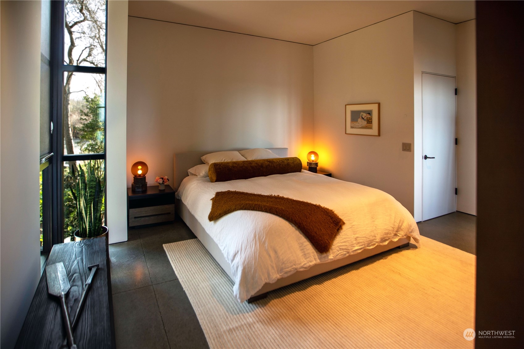 265 Rainshadow Road San Juan Island, WA 98250 - Photo 29 of 40 a bedroom with a bed lamp closet and large window