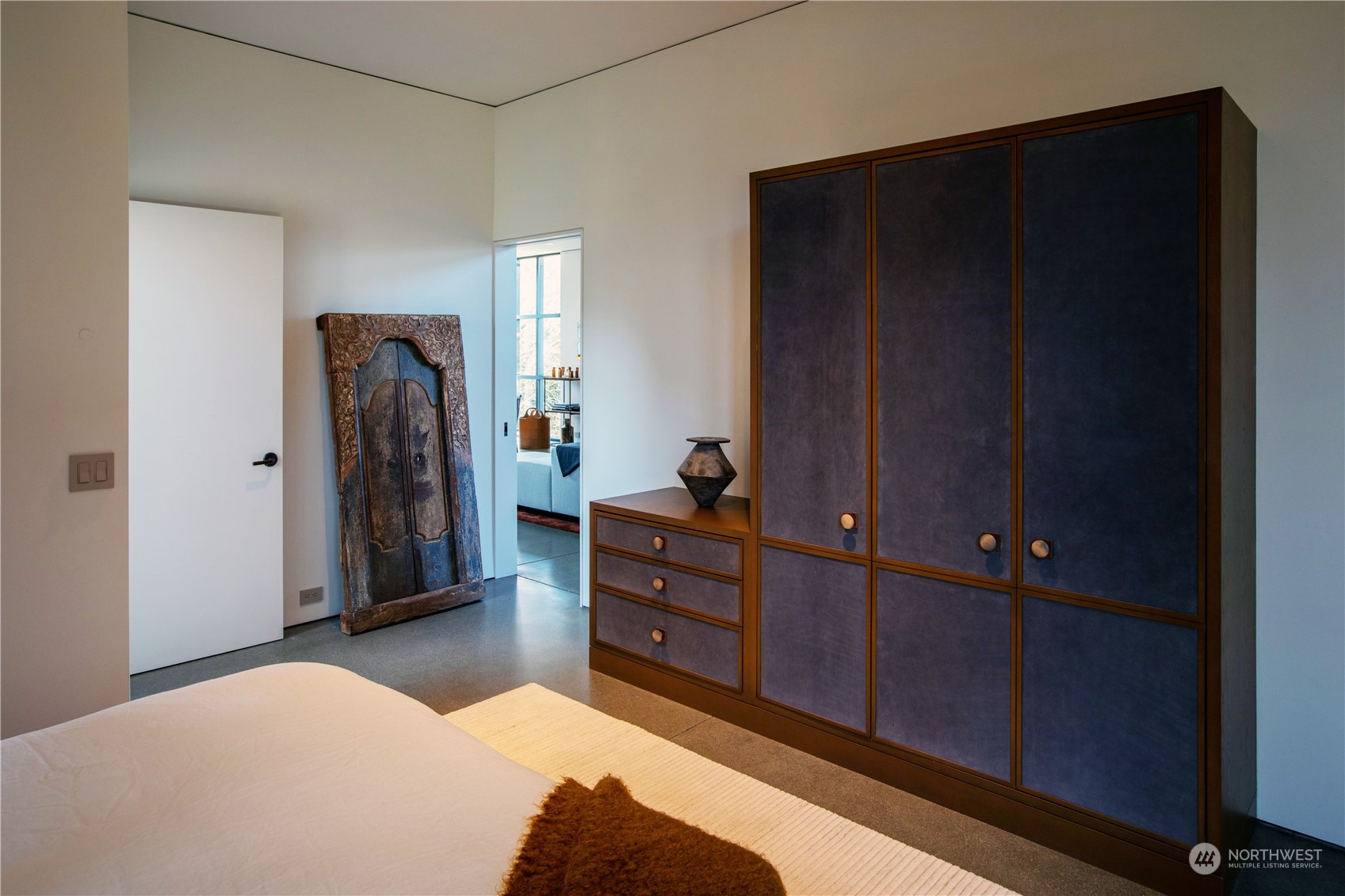 265 Rainshadow Road San Juan Island, WA 98250 - Photo 30 of 40 a bedroom with a bed and a dresser