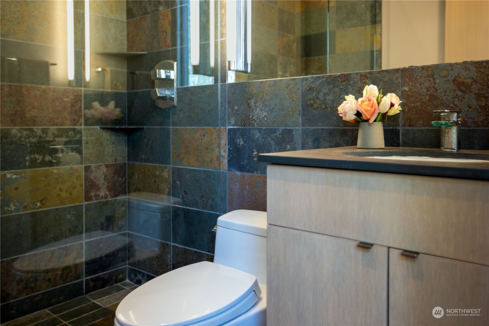 265 Rainshadow Road San Juan Island, WA 98250 - Photo 40 of 40 a bathroom with a sink a toilet and a mirror