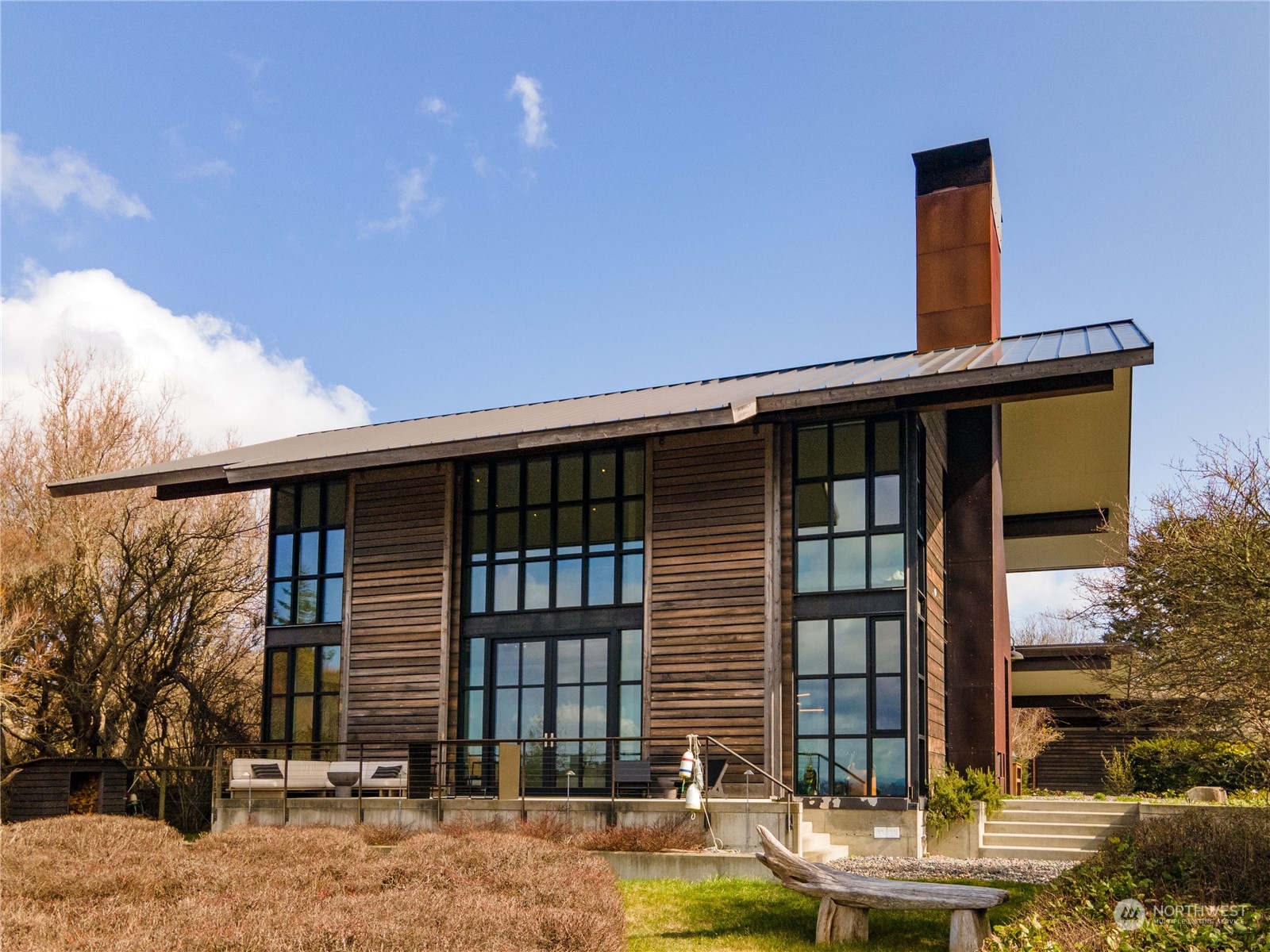 265 Rainshadow Road San Juan Island, WA 98250 - Photo 4 of 40 a front view of a house with garden