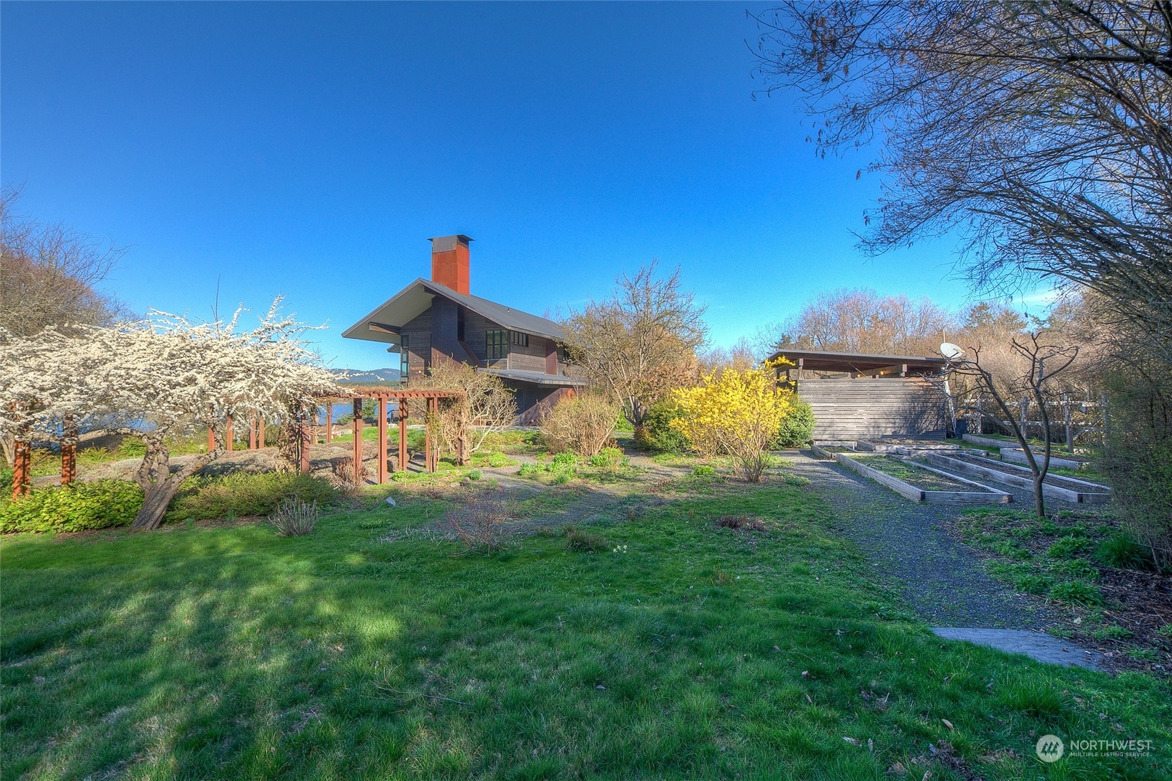 265 Rainshadow Road San Juan Island, WA 98250 - Photo 5 of 40 a view of a backyard with plants and a garden