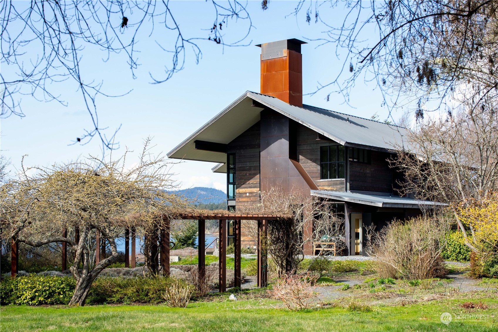 265 Rainshadow Road San Juan Island, WA 98250 - Photo 6 of 40 a view of a house with a yard