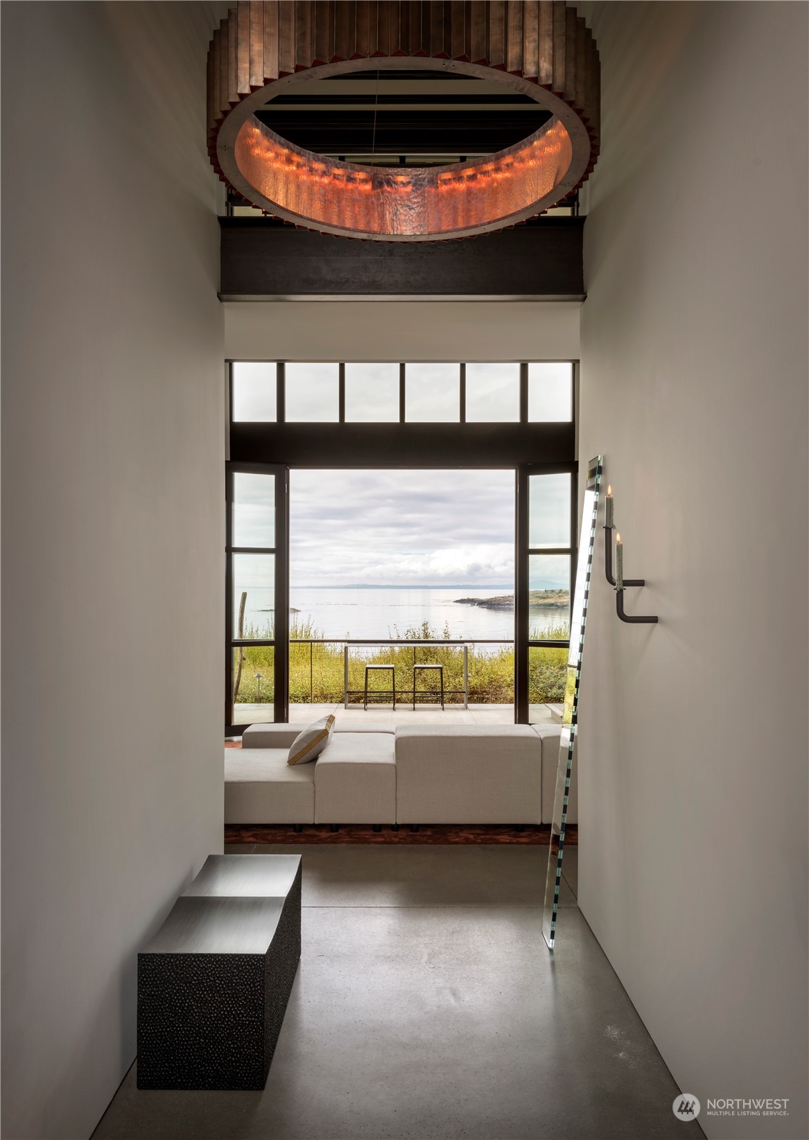 265 Rainshadow Road San Juan Island, WA 98250 - Photo 10 of 40 a room with furniture and a floor to ceiling window