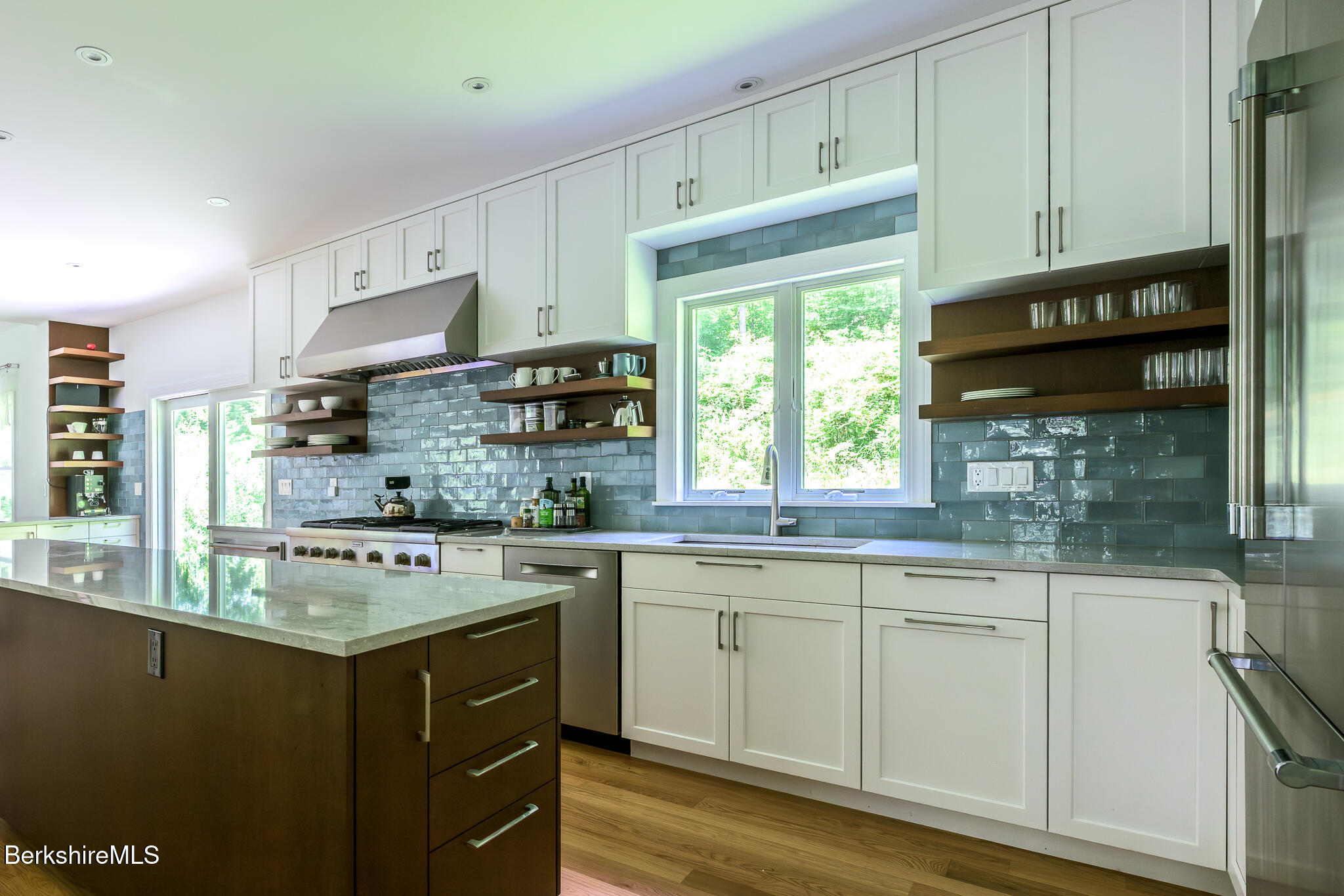 50 Old Village Road Alford, MA 01230 - Photo 17 of 66 a kitchen with stainless steel appliances granite countertop a stove a sink and a microwave