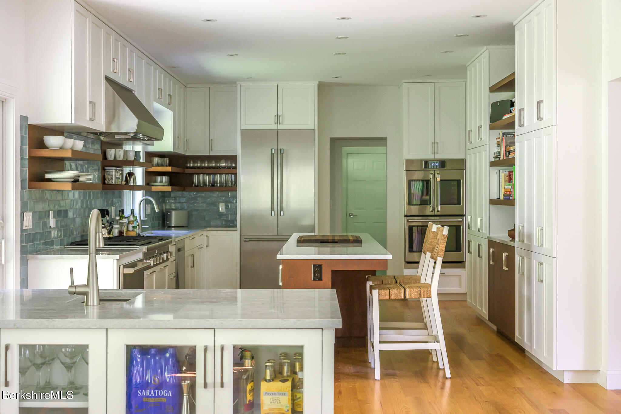 50 Old Village Road Alford, MA 01230 - Photo 19 of 66 a kitchen with stainless steel appliances kitchen island granite countertop a refrigerator and stove