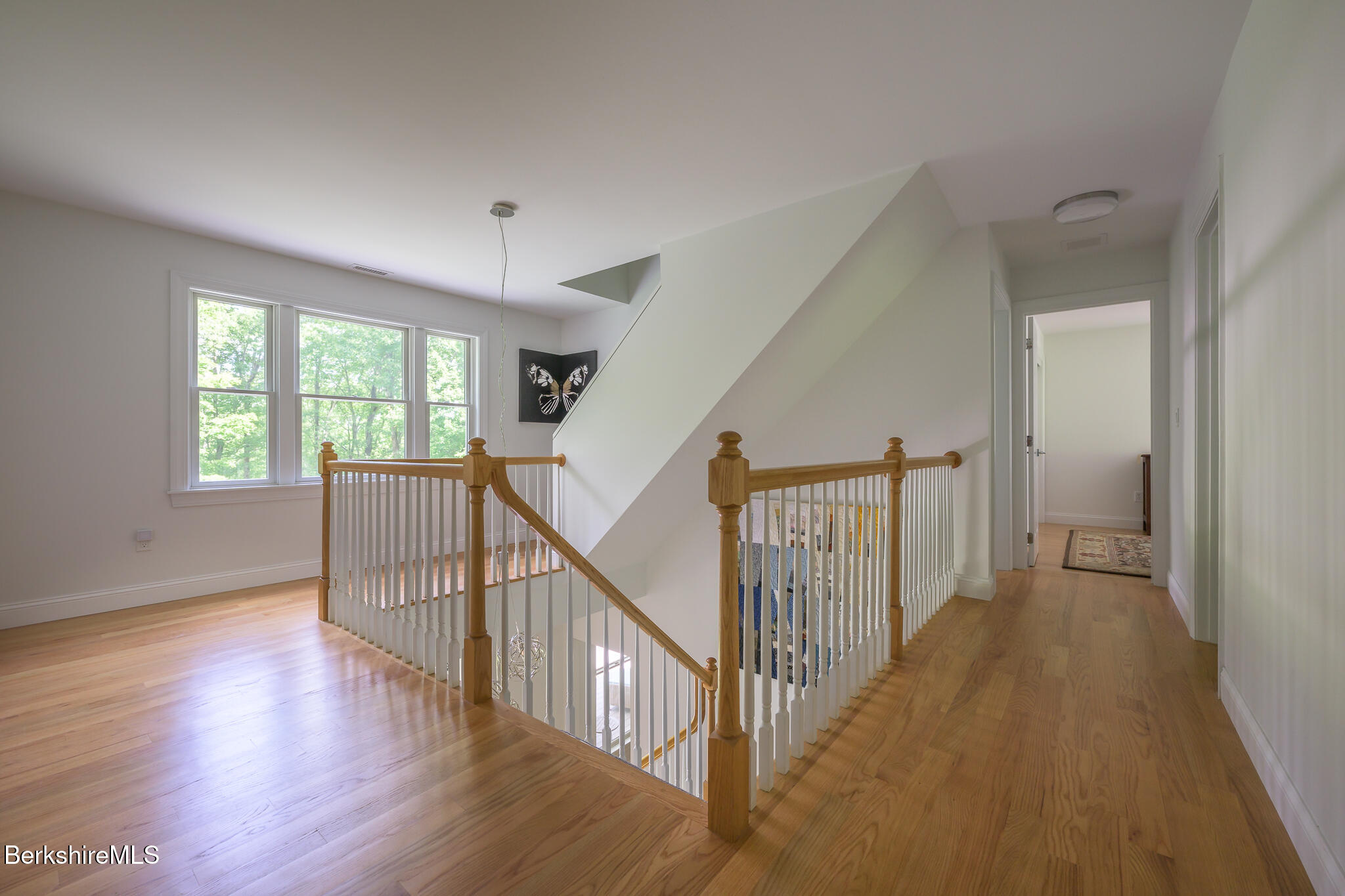 50 Old Village Road Alford, MA 01230 - Photo 31 of 66 a view of a hallway with wooden floor and windows